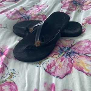 black reef flip flops